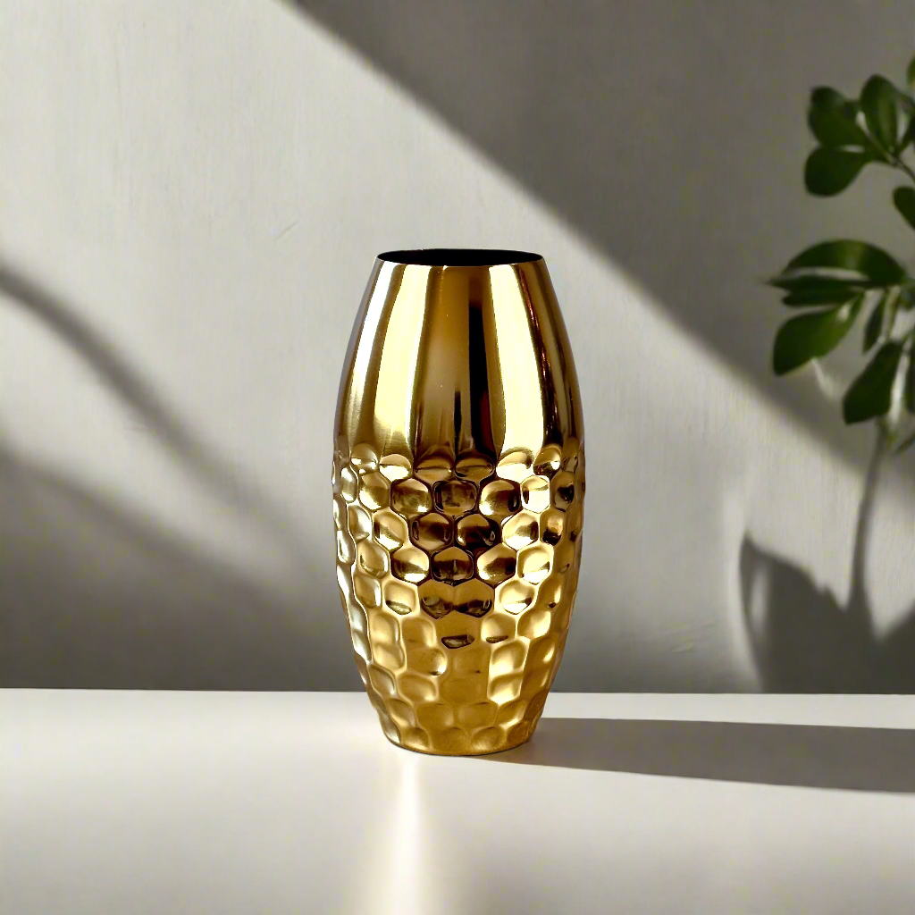 Product image of a Metal Gold Vase from Indian Impressions, featuring a sleek and modern design with a polished gold finish. Perfect as a standalone décor piece or for displaying flowers, this vase adds elegance and sophistication to any space. Ideal for Vastu, home décor, or gifting.