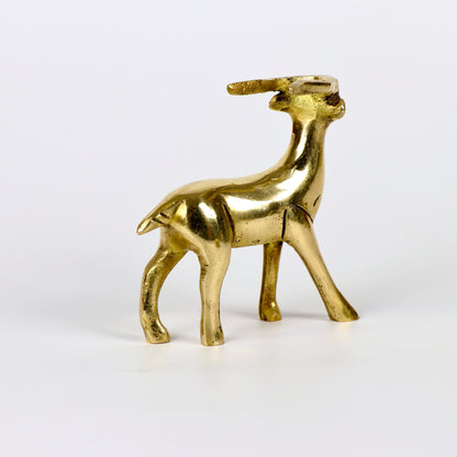 Image of a brass deer statue, elegantly designed with intricate detailing. The deer is depicted in a graceful standing posture, symbolizing peace, harmony, and gentleness. Crafted from polished brass, this statue is ideal for Vastu, home décor, or gifting to enhance positive energy and elegance in any space.