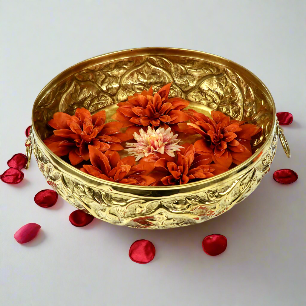 Product image of a Brass Gulmohar Urli from Indian Impressions, featuring a beautifully crafted design with intricate floral detailing. The urli has a polished brass finish, ideal for adding a touch of elegance to home décor, spiritual rituals, or gifting, and is perfect for enhancing the ambiance of any space.