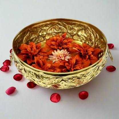 Product image of a Brass Gulmohar Urli from Indian Impressions, featuring a beautifully crafted design with intricate floral detailing. The urli has a polished brass finish, ideal for adding a touch of elegance to home décor, spiritual rituals, or gifting, and is perfect for enhancing the ambiance of any space.