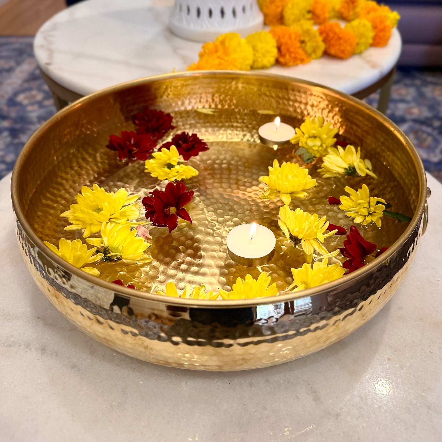 Product image of a Brass Hammered Classic Urli from Indian Impressions, featuring a traditional hammered texture that enhances its rustic charm. The urli is crafted from polished brass, making it ideal for home décor, spiritual rituals, or gifting, bringing an elegant and timeless appeal to any space.