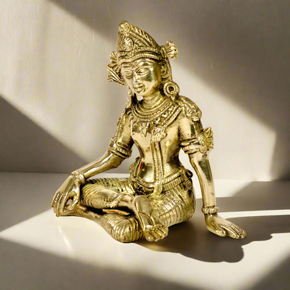 Product image of a Brass Indra Dev Idol from Indian Impressions, showcasing Lord Indra seated on his throne, holding traditional symbols. The idol is intricately crafted with fine details and a polished brass finish, making it an ideal piece for spiritual practices, home décor, or gifting to bring divine blessings and prosperity.