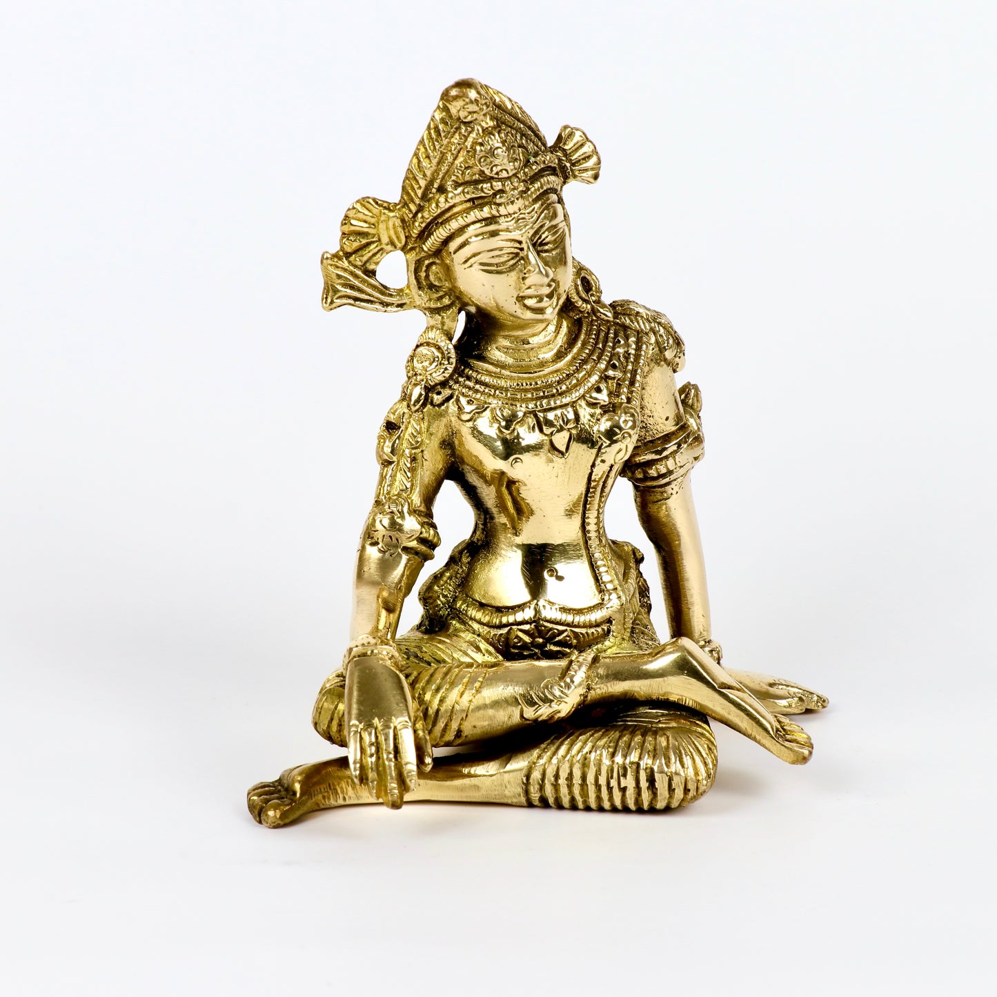 Product image of a Brass Indra Dev Idol from Indian Impressions, showcasing Lord Indra seated on his throne, holding traditional symbols. The idol is intricately crafted with fine details and a polished brass finish, making it an ideal piece for Vastu, spiritual practices, home décor, or gifting to bring divine blessings, prosperity, and positive energy.