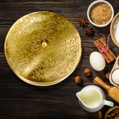 Product image of a Brass Spice Box from Indian Impressions, featuring a traditional round design with multiple compartments for storing spices. Crafted from polished brass with intricate detailing, this spice box is both functional and decorative, ideal for enhancing Vastu energy, kitchen aesthetics, or gifting.