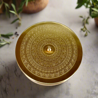 Product image of a Brass Spice Box from Indian Impressions, featuring a traditional round design with multiple compartments for storing spices. Crafted from polished brass with intricate detailing, this spice box is both functional and decorative, ideal for enhancing Vastu energy, kitchen aesthetics, or gifting.