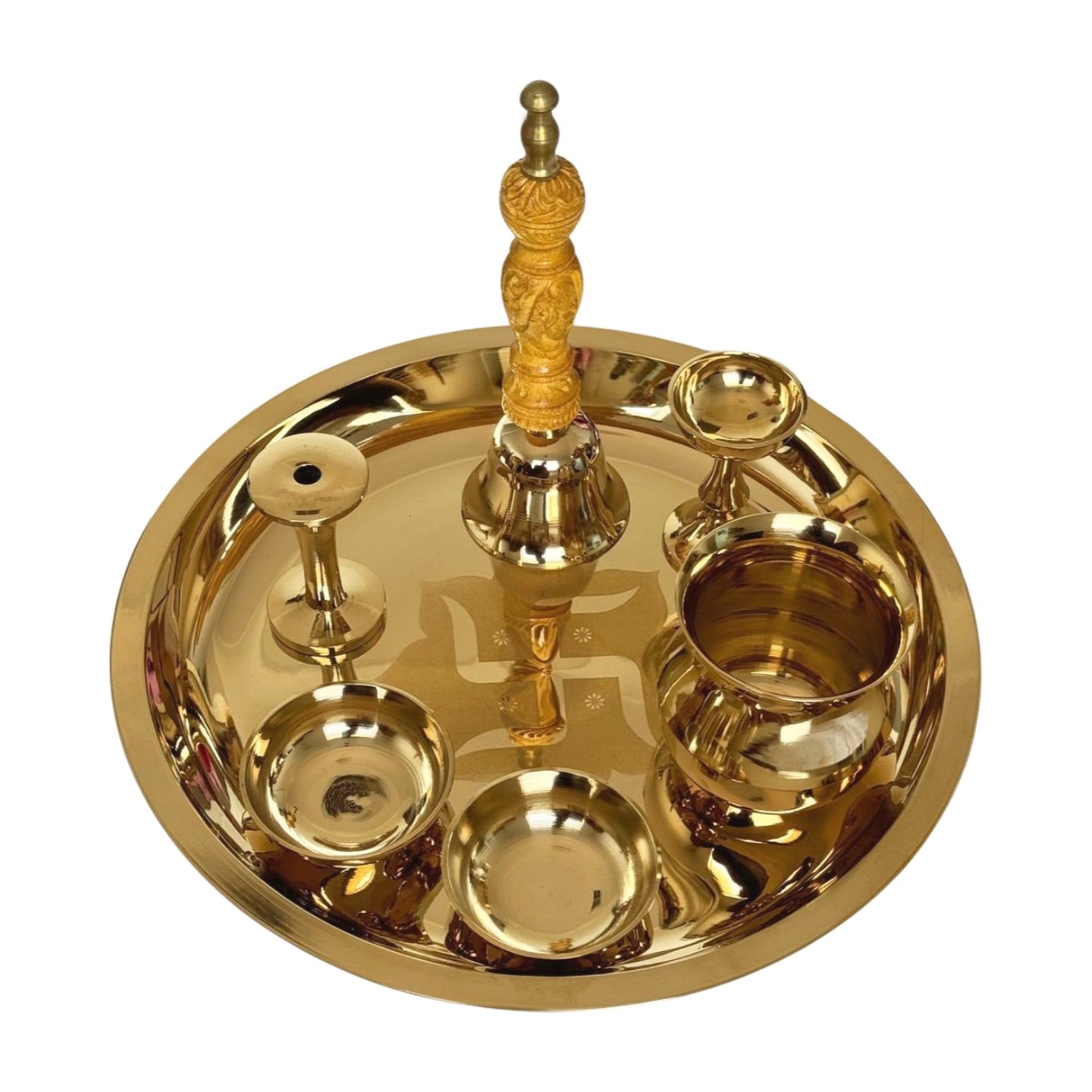 Product image of a Bronze Pooja Thali Set from Indian Impressions, featuring a beautifully handcrafted design. The set includes a thali, diya, incense holder, and small bowls, all crafted from polished bronze. Perfect for Vastu, spiritual rituals, home décor, or gifting, it adds a traditional and elegant touch to any sacred space.