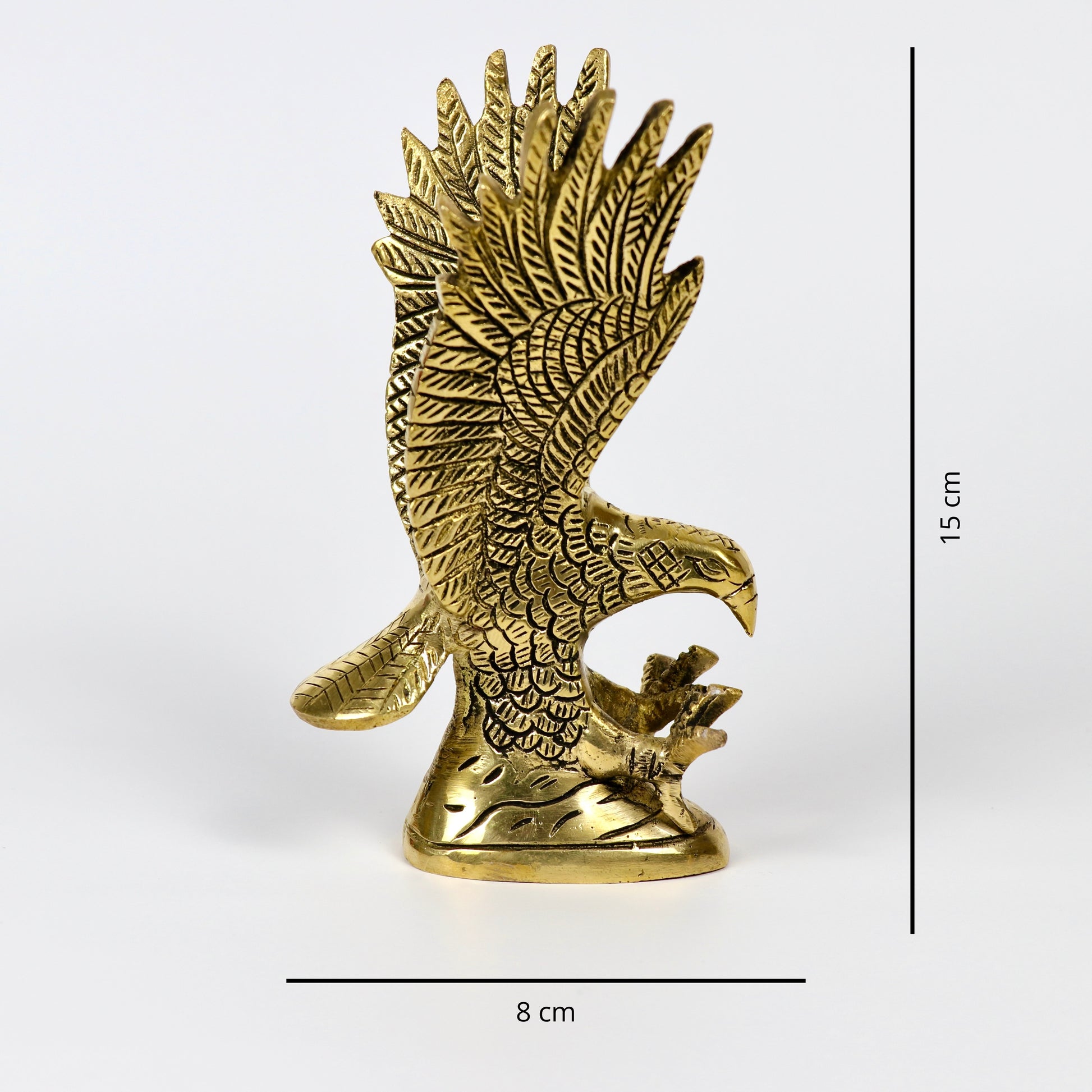 Product image of a Brass Eagle figurine from Indian Impressions, depicting the eagle in a poised stance with outspread wings. Crafted with intricate detailing and a polished brass finish, this piece symbolizes strength, protection, and vision, making it ideal for Vastu, home décor, or gifting.