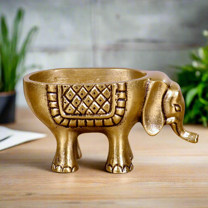 Product image of an Elephant Antique Brass Finish figurine from Indian Impressions, intricately crafted with detailed features. The elephant, symbolizing strength, wisdom, and good luck, is finished in a rich antique brass tone. The figurine comes with a gift box, making it an ideal gift for home décor, spiritual practices, or Vastu.