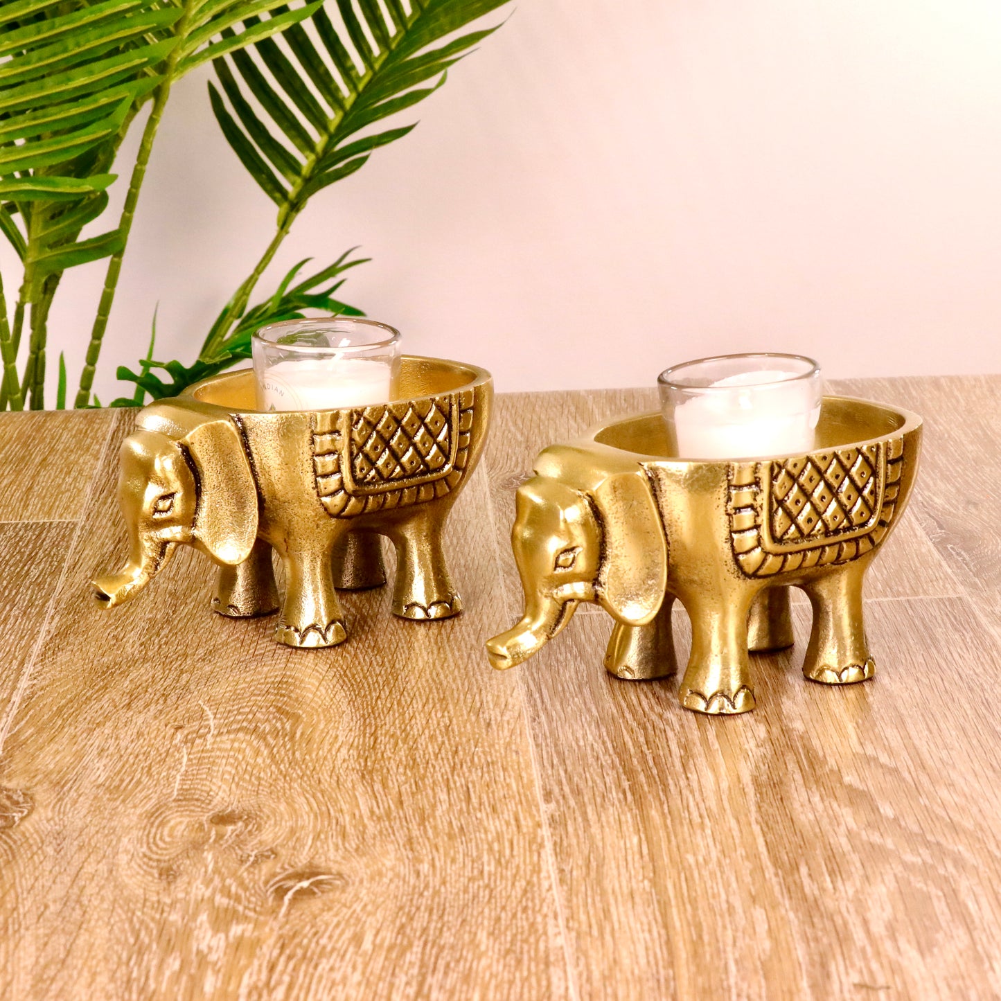 Product image of an Elephant Antique Brass Finish figurine from Indian Impressions, intricately crafted with detailed features. The elephant, symbolizing strength, wisdom, and good luck, is finished in a rich antique brass tone. The figurine comes with a gift box, making it an ideal gift for home décor, spiritual practices, or Vastu.