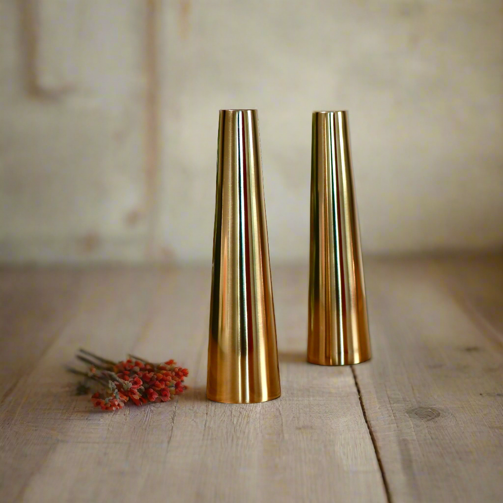 Product image of a Gold Slim Cone Vase Set of 2 from Indian Impressions, featuring sleek, modern designs with a polished gold finish. These vases are ideal for displaying flowers or as standalone decorative pieces. Perfect for enhancing Vastu energy, home décor, or gifting, adding elegance and sophistication to any space.