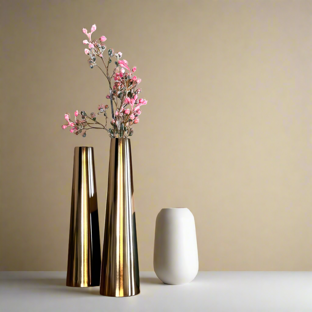 Product image of a Gold Slim Cone Vase Set of 2 from Indian Impressions, featuring sleek, modern designs with a polished gold finish. These vases are ideal for displaying flowers or as standalone decorative pieces. Perfect for enhancing Vastu energy, home décor, or gifting, adding elegance and sophistication to any space.