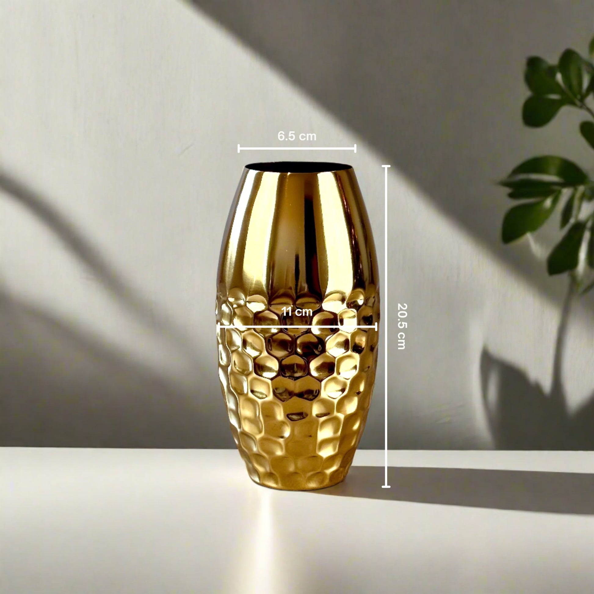 Product image of a Metal Gold Vase from Indian Impressions, featuring a sleek and modern design with a polished gold finish. Perfect as a standalone décor piece or for displaying flowers, this vase adds elegance and sophistication to any space. Ideal for Vastu, home décor, or gifting.