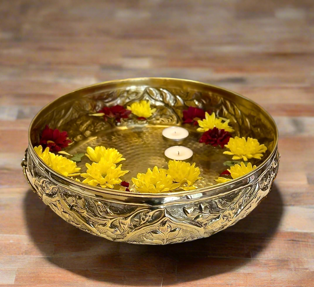 Product image of a Brass Gulmohar Urli from Indian Impressions, featuring a beautifully crafted design with intricate floral detailing. The urli has a polished brass finish, ideal for adding a touch of elegance to home décor, spiritual rituals, or gifting, and is perfect for enhancing the ambiance of any space.