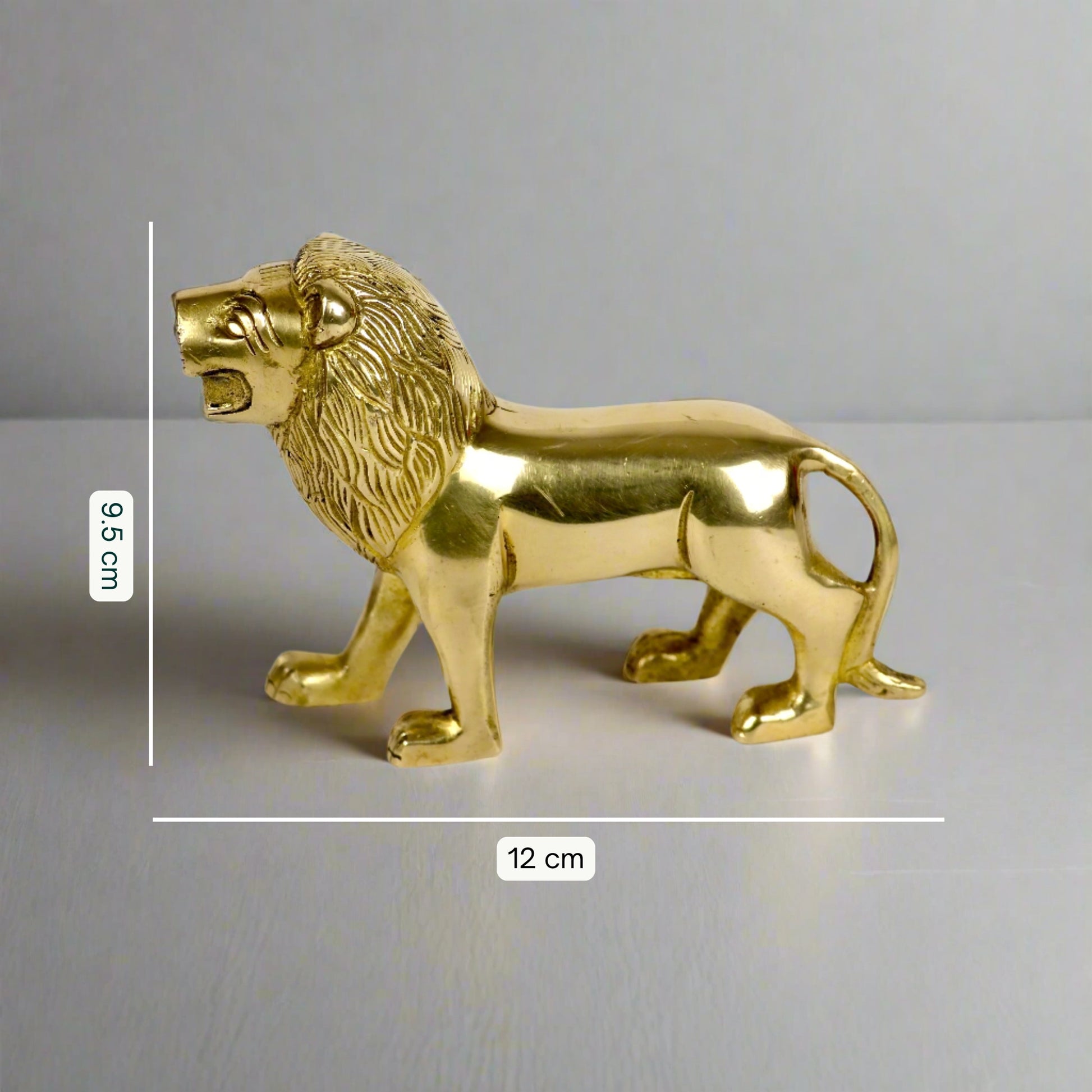 Product image of a Brass Lion figurine from Indian Impressions, showcasing a majestic lion in a poised stance with intricate detailing. Symbolizing strength, courage, and protection, the polished brass finish enhances its regal appeal. Perfect for Vastu, home décor, or gifting to bring power and positive energy to any space.