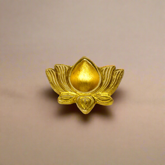 Product image of a Brass Lotus Diya from Indian Impressions, featuring an elegant lotus-shaped design with intricate detailing. The diya is crafted from polished brass, making it ideal for holding oil or ghee for spiritual rituals, enhancing the ambiance of any space. Perfect for Vastu, home décor, or gifting, it symbolizes purity and divine light.