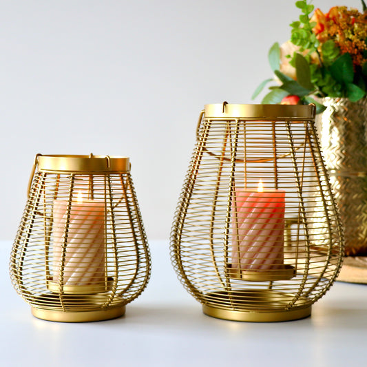 Product image of a Metal Cage Lantern from Indian Impressions, featuring a sleek, openwork cage design with a polished finish. This lantern is ideal for holding candles or LED lights, adding a warm and elegant ambiance to any space. Perfect for Vastu, home décor, or gifting.