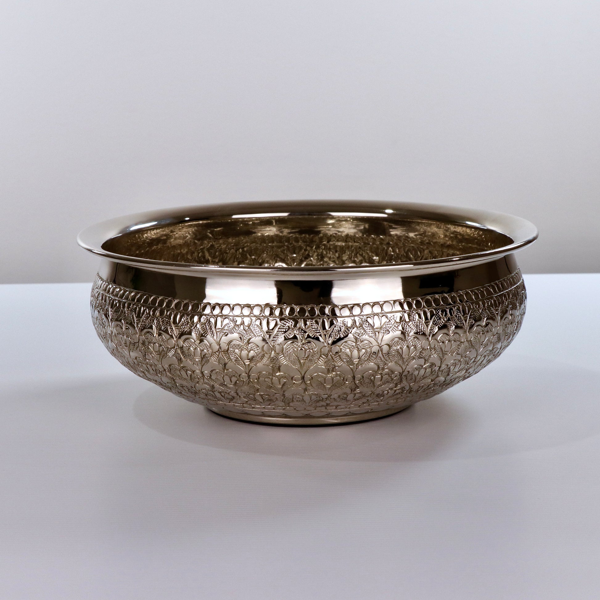 Product image of the Modini Chitai Urli Silver from Indian Impressions, showcasing an intricately handcrafted design with detailed patterns. Made with a polished silver-tone finish, this urli is perfect for Vastu, home décor, festive decorations, or gifting, bringing elegance and positive energy to any space.