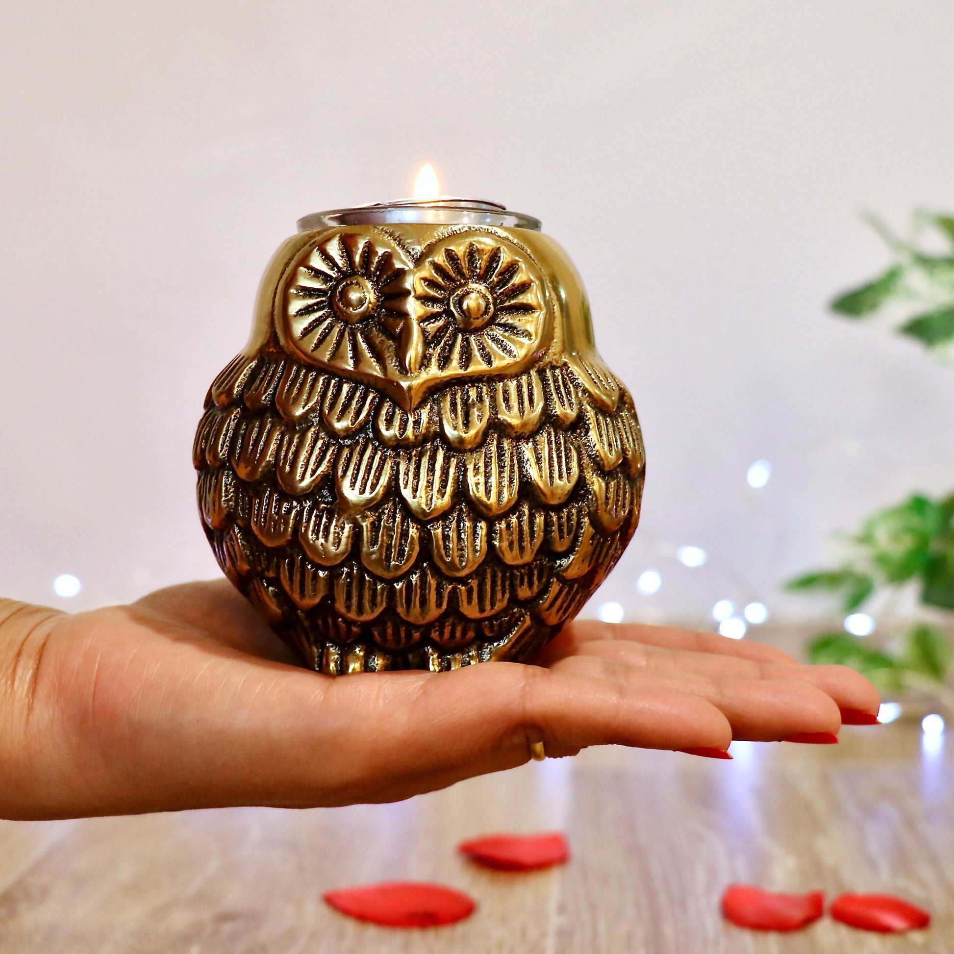 Product image of the Owl Figurine Pair Tea light Holder with Antique Brass Finish from Indian Impressions, featuring two intricately designed owl statues with detailed craftsmanship. Symbolizing wisdom and protection, these figurines are ideal for Vastu, home décor, or gifting, adding a touch of charm and positive energy to any space.