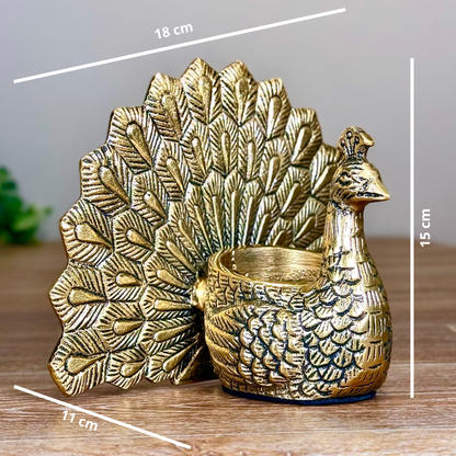 Product image of the Peacock Candle Holder with Antique Brass Finish from Indian Impressions, showcasing a stunning peacock design with intricate detailing and a vintage-inspired finish. Ideal for holding candles, this piece is perfect for Vastu, home décor, festive occasions, or gifting, adding elegance and positive energy to any space.