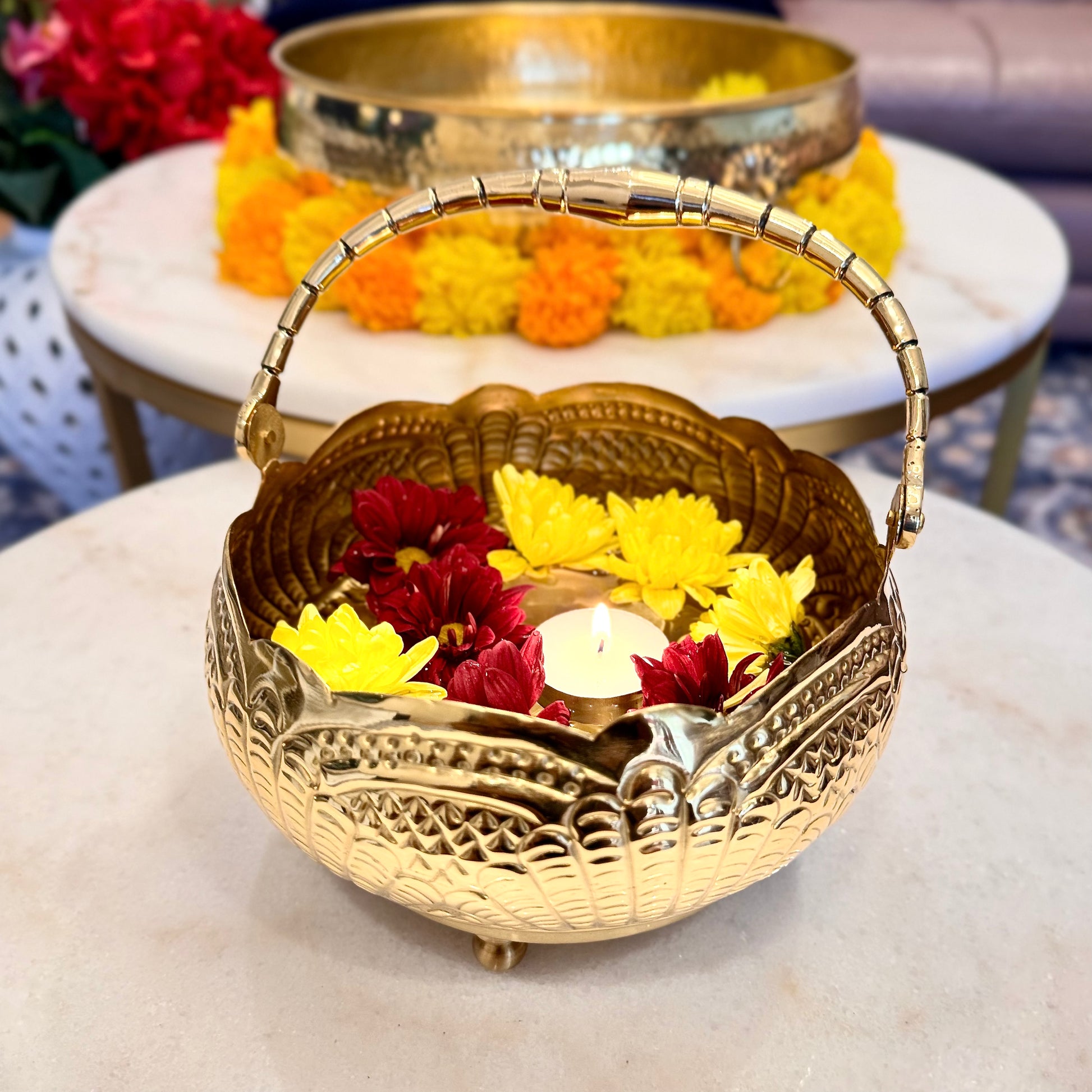 Product image of a Puspam Brass Flower Basket from Indian Impressions, featuring an intricately handcrafted design with traditional motifs. Made from polished brass, this elegant basket is perfect for holding flowers, enhancing Vastu energy, festive décor, or gifting, adding a touch of charm and positivity to any space.