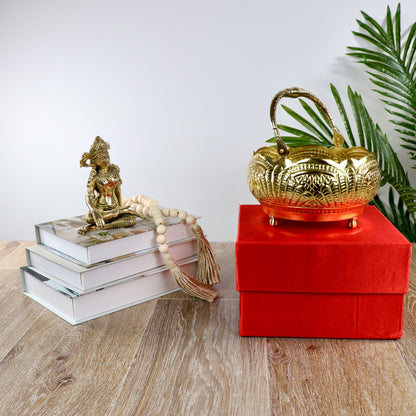 Product image of a Puspam Brass Flower Basket from Indian Impressions, featuring an intricately handcrafted design with traditional motifs. Made from polished brass, this elegant basket is perfect for holding flowers, enhancing Vastu energy, festive décor, or gifting, adding a touch of charm and positivity to any space.