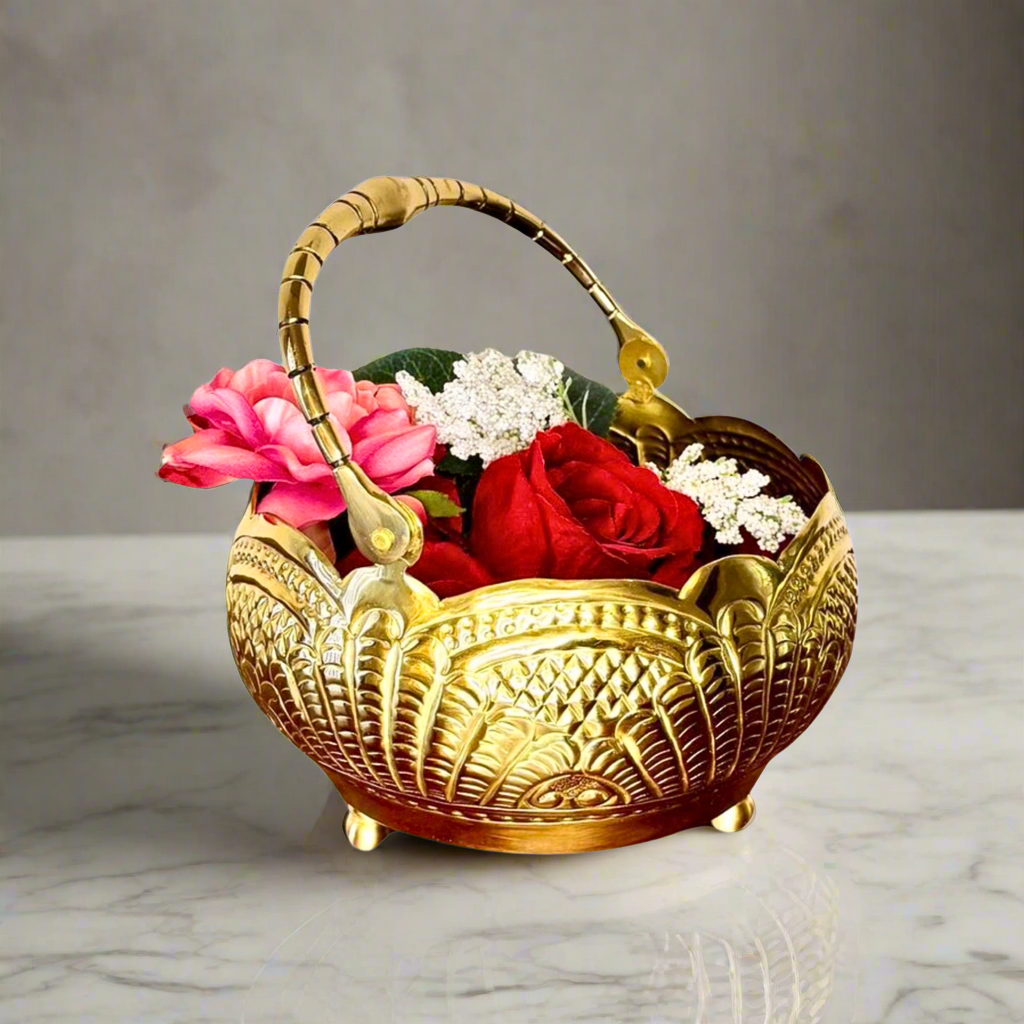 Product image of a Puspam Brass Flower Basket from Indian Impressions, featuring an intricately handcrafted design with traditional motifs. Made from polished brass, this elegant basket is perfect for holding flowers, enhancing Vastu energy, festive décor, or gifting, adding a touch of charm and positivity to any space.