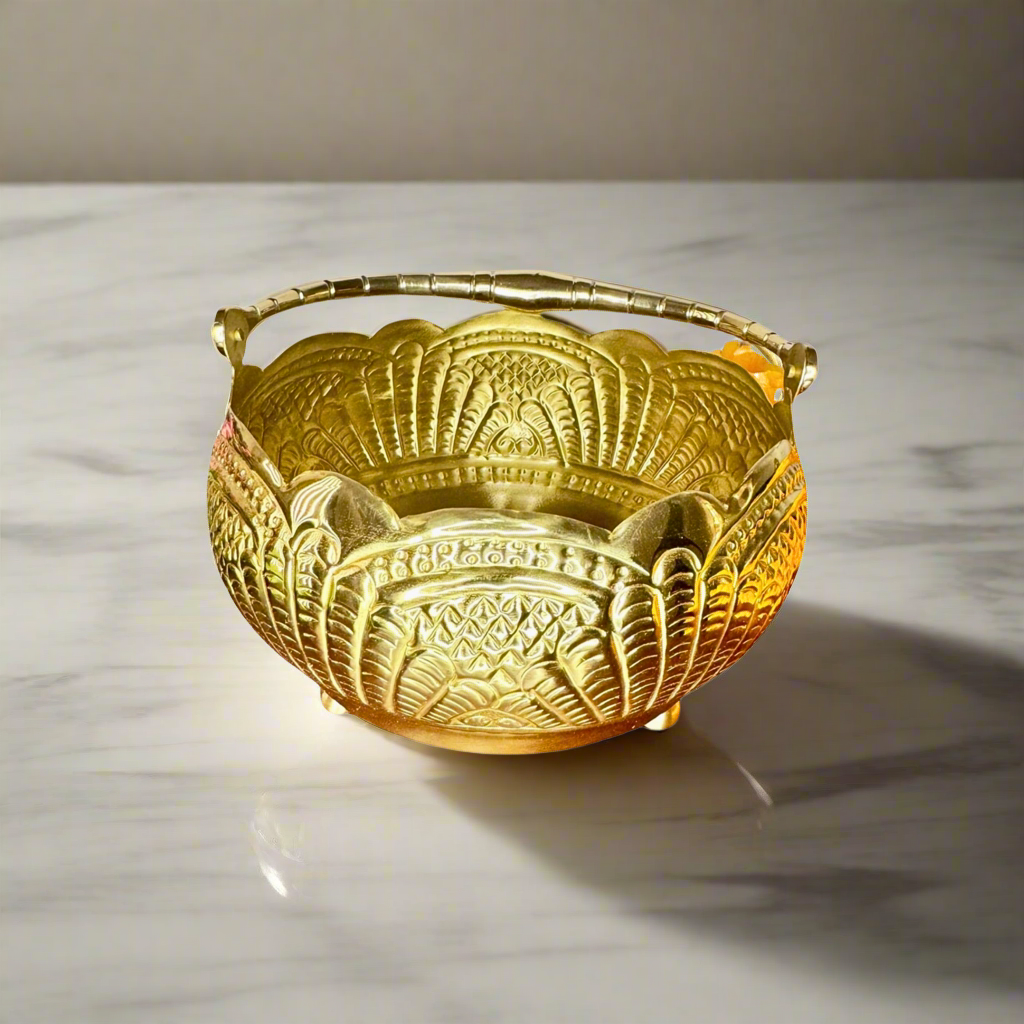 Product image of a Puspam Brass Flower Basket from Indian Impressions, featuring an intricately handcrafted design with traditional motifs. Made from polished brass, this elegant basket is perfect for holding flowers, enhancing Vastu energy, festive décor, or gifting, adding a touch of charm and positivity to any space.