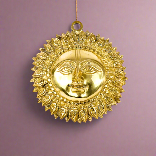 Product image of a Brass Sun Idol from Indian Impressions, featuring a radiant design with intricate detailing symbolizing energy and vitality. Crafted from polished brass, this idol is ideal for Vastu, spiritual practices, home décor, or gifting, bringing positivity and warmth to any space.